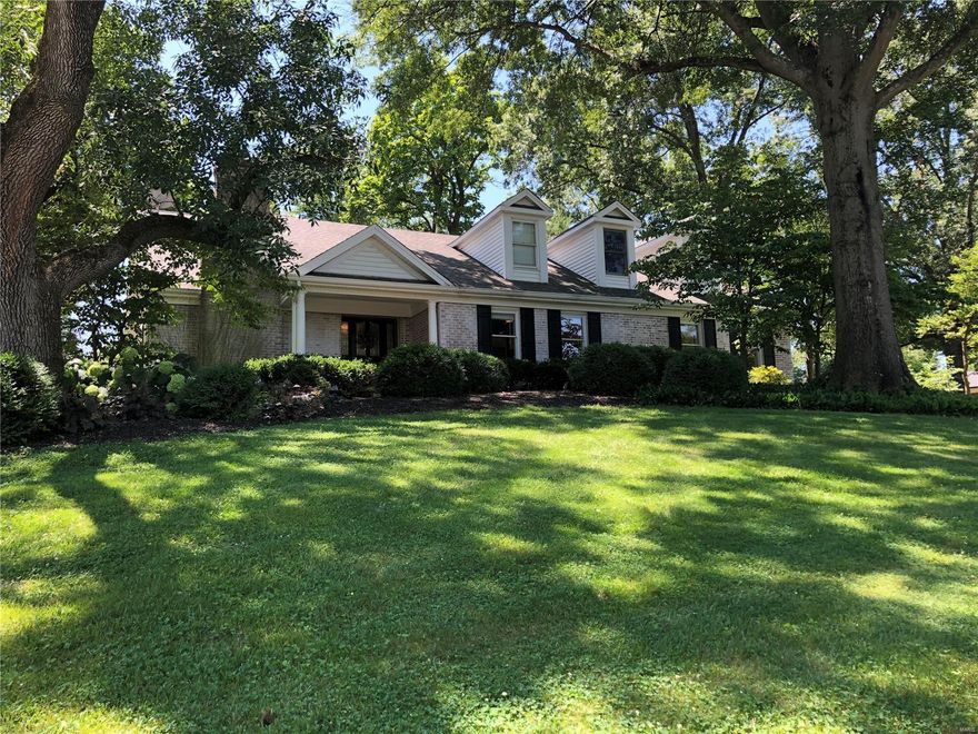 IRRESISTIBLE OPPORTUNITY! This property will surprise and delight. The charming home is nestled on a one-acre lot, and every inch of has been updated for today's lifestyle. The foyer leads to stunning living and dining rooms with hardwood floors and chic finishes. The gorgeous, updated kitchen will delight, with a sunny breakfast room and convenient laundry nearby. The great room features a stone fireplace, vaulted ceiling and stunning views of the patio and backyard. The main floor master suite is a true oasis, with a walk-in closet space that can only be described as opulent, with a spectacular bath adjoining. Two other bedrooms on the main floor share an updated jack-n-jill bath, with 3 additional light-filled bedrooms and a loft playroom (complete with tunnel) upstairs. The lower level rec room includes galley kitchen, exercise room, bonus room and hobby room. Three car garage and an ideal location close to hospitals & schools make this listing irresistible.