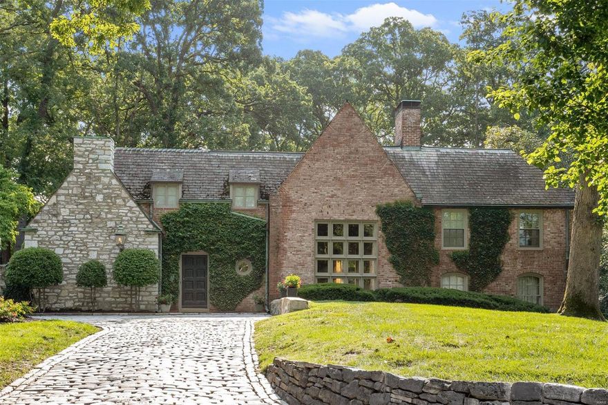 This once-in-a-lifetime offering is cultivated, fiercely unique, and expressive of the finest of residential design. It is a true gathering spot that welcomes and embraces all who cross its threshold. Designed by the architecture firm of Hall and Proetz, who were responsible for some of the finest homes built in St. Louis between the two World Wars, this 4 bedroom, 4.5 bathroom home sits on over 2 acres of incredibly lush, private land, on one of the most coveted lanes of Ladue. Entertaining/family areas are warm and spacious allowing for numerous activities to pass concurrently. Completed in 1936, this property features just over 4,100 sqft of beautifully laid out interior space featuring hand-hewn moldings, a gourmet kitchen that opens to a modern family room, designed by Harris Armstrong, with three sides of soaring picture windows gazing out to the expansive backyard.