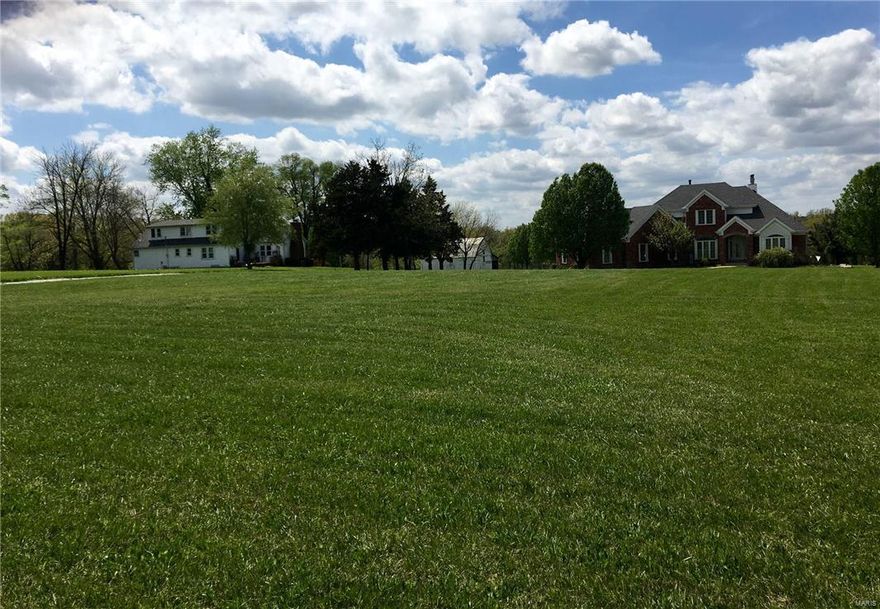 HUGE Price Reduction for spring sale!Exceptional Farm 10+-Ac!Great location to Hwy 40/70.Property offers TWO Homes,Historic Barn,Pole Barn,Work Shop/Garage,inground salt water Pool with Pool House(w/ kitchen,bath,laundry)and Two Ponds!The Main House- 1 1/2 Story Brick Front w/3 car rear entry garage,boasts approx. 4533 sq ft of Living space w/ a Mother In Law Quarters in the Lower Level w/ full kitchen,dining,bedroom,bath and fireplace.Main Floor Great Room w/fireplace,soaring ceilings, beautiful Atrium leading to Lower Level.Kitchen is perfect for the chef with upgraded cabinetry,appliances,wet bar,large breakfast room lined w/ windows and Screened Porch!Main Level Master has fireplace,private deck,coffered ceiling,Master Bath Suite w/ oversized custom vanity,whirlpool tub and sep shower,His/Her Walk In closets.Upper Level has 2 beds & Jack/Jill Bath. Farm House is income producer,2000+sq ft.,3-4 Beds,Main Floor Master w/ Bath,Woodburning FP,Huge Kitchen& more!Agent related to Seller. Some Accessible Features