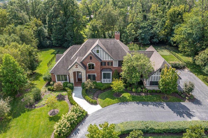 Situated on a beautiful 2.2 Acre Lot, this Extraordinary Colonial French Estate home from Terbrock Custom Builders. Impressive 2-sty foyer leads to study w/ box beam ceiling, elegant dining room & stunning great room w/ barrel vaulted entryways, granite fireplace flanked by built-in bookcases, wet bar & dramatic wall of windows. Designer kitchen with 42” cherry cabinetry, granite countertops & commercial grade appliances adjoins light-filled breakfast room & hearth room highlighted by floor-to-ceiling stone fireplace. Coffered master bedroom suite w/ wide bay window, luxury bath w/ jetted tub & shower spa & private deck offers an appealing retreat. The 2nd floor extends the living quarters w/ 3 additional ensuite bedrooms, loft sitting area & 2nd laundry. Lower Level includes recreation room w/ wet bar & wine cellar, family room with fireplace, workout room, 5th bedroom & full bath. Resort style pool & hot tub surrounded by landscaped gardens plus patio with pergola & grilling station. Additional Rooms: Wine Cellar