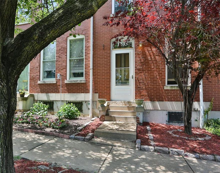 Updated row house in historic Lafayette Square neighborhood! Feel the openness of tall ceilings & sky lights as well as the complimentary paint colors as you enter the living room. Kitchen includes newer counter & sink (2012), stainless steel appliances & adjoins to the breakfast room. Entire first floor features hardwood floors & newer paint (2012). Find two immaculate bedrooms upstairs with newer carpet, as well as a spacious full bath. Partially finished LL is great for home office, kids play area or additional living space. Enjoy the outdoors in the quaint landscaped back yard complete with deck & privacy fence. Within walking distance of shops, restaurants & the park, where you can take a stroll & gaze at beautiful Victorian homes! Easy access to highways, downtown, St. Louis University & all things St. Louis! St. Louis city public charter school, Lafayette Preparatory Academy, is less than a half mile from home.  Come see for yourself how you could make this HOUSE your HOME!