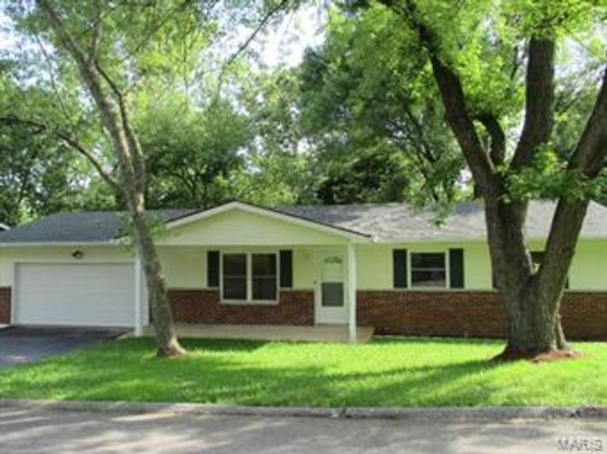 Mature Trees, Level Front Yard, Oversized 2 Car Garage, brick elevation & Covered Porch give this beautiful ranch home excellent curb appeal! As soon as you enter this home you will notice the brand new neutral carpeting and paint through out. The family room offers plenty of natural lighting as well as an open space looking into the kitchen. The custom update kitchen features dark custom cabinetry with a complimentary flooring and tile back splash as well as new appliances! The main floor master bedroom suite has convenient access to the master bathroom. The unfinished lower level awaits your finishing touches that would add additional living space. The lower level walks out to a spacious patio and large, level fenced in back yard. This home is move in ready & sure to please!