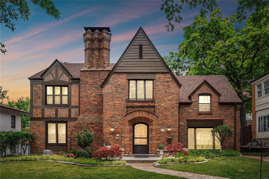 Beautiful landscaping welcomes you to this elegant Tudor home in sought after Davis Place with intricate exterior brick work. This light, bright home features 3 spacious living areas  all with custom cabinetry on the main floor for easy entertaining, relaxing and enjoying family and friends.  A separate dining room lends itself to large gatherings. The kitchen appointed with beautiful custom cherry cabinets, 2 wall ovens, warming drawer, a downdraft electric cooktop; the French door refrigerator and the dishwasher have cabinet panel fronts. The master bedroom has 2 closets and the master bath has a large soaking tub and stained glass window. Two bedrooms share a jack and Jill bathroom.  The 4th bedroom is large with unsuited bath with tub.  The finished lower level has a built in desk/work area and shelving. The 2 car garage has 220 electric service  New roof and gutters 6/2024
Close to schools, Shaw Park, shopping, transportation, restaurants. An easy walk to downtown Clayton.