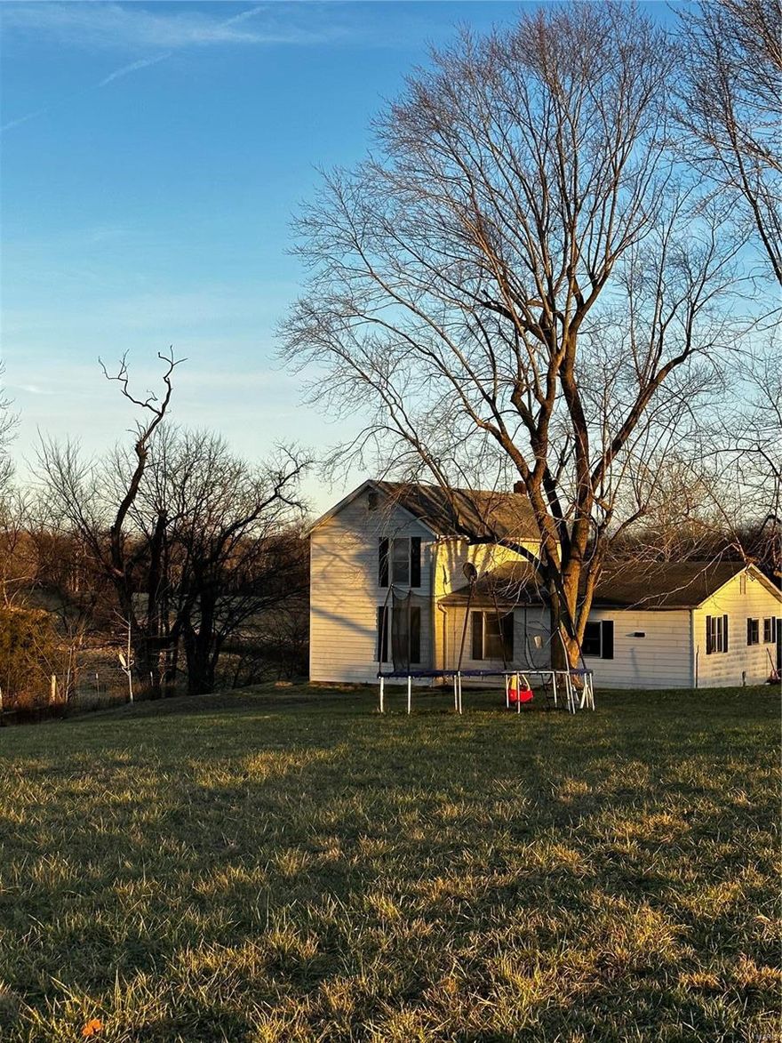 108 m/l Beautiful Acres with Farm house and large barn. Close to town with privacy and water frontage! This farm is mostly bottom ground along the year round Wolf Creek with upper pastures and some wooded portions. Amazing property to farm, raise livestock or use for recreational purposes. Home has had numerous updates and sits overlooking the farm. Original 1900's barn is in great shape and could easily be converted into a horse barn or shop! Not often do farms this close to town come up for sale!