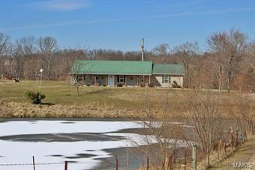 Beautiful home in the country! Don't miss the chance to sit on this front porch and overlook your pond in privacy! Enjoy a 4 bedroom, 2 bath home on 8 +/- acres with a pond, and a 24 x 40 shop! This home welcomes you into an expansive great room with vaulted ceiling, open kitchen with modern floor tile, mobile island , and roomy dining area. The three spare bedrooms and sizable guest bath have been freshly painted. The master bedroom has a walk-in closet, and master bath with separate vanity area! The house is on a private well, has a metal roof, and over-sized two car garage. In Jackson School District!