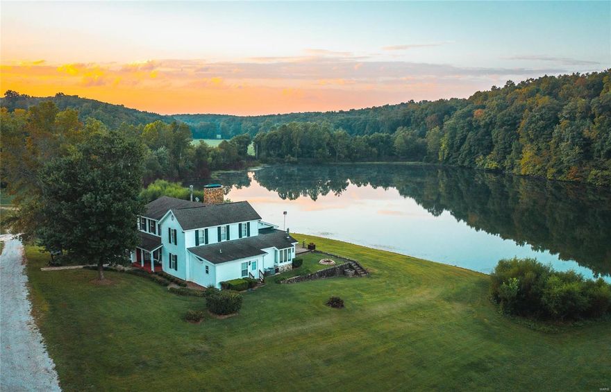 This 498 acre holding is one of the most unique properties the country has to offer. You’ll notice Black angus cattle & the Thunder Valley herd of horses roaming. The main home is an iconic 1940s farmhouse. Boasting 4,200 sq ft of living
space & sitting in the most picturesque setting in the state of Missouri. This Property
is built for entertaining with 3 separate homes. Thousands of acres of Mark Twain National Forest border the property to the East.
Enjoy the lake under the covered dock or boat around on the detachable dock with
outboard motor for summer recreation. Bordering thousands of acres of Mark Twain National Forest to the East, there is truly no limits. Small bunkhouse for guests is conveniently located a short walk from the main house. Additionally, the property includes a 3 bed/2 bath caretakers house. Farm and guest house come fully furnished minus some small personal property items. Jet skis, 4 atvs, Polaris ranger, case tractor, & more will be included in the sale.