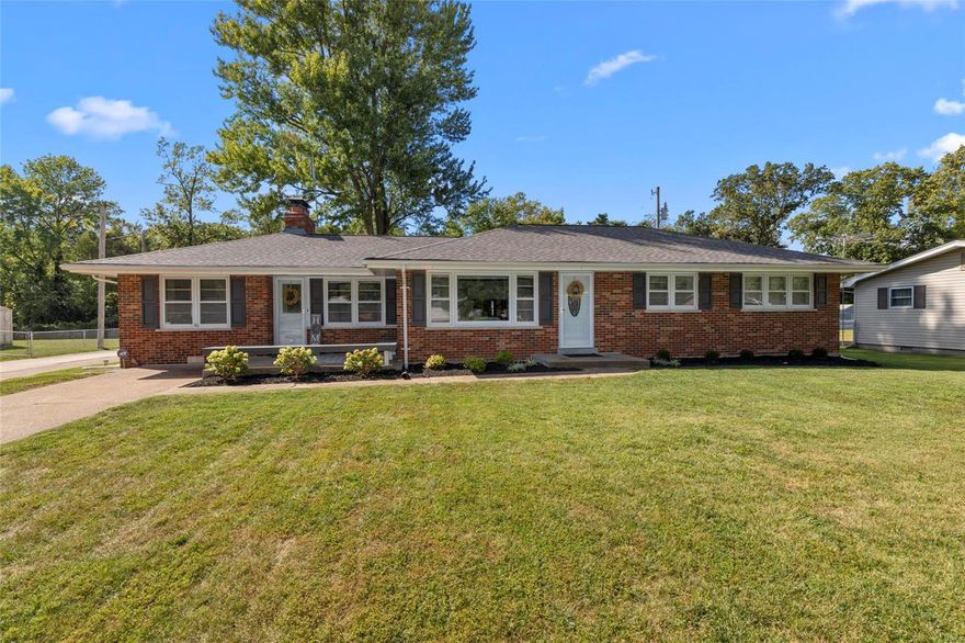 Beautiful ranch home situated on a large lot in Maryland Heights! Plenty of living space to entertain! 4 bedroom 2 1/2 bath.  Wood burning brick fireplace and hardwood floors throughout. Kitchen offers stainless steel appliances and cabinets galore. Sliding doors lead to a covered back patio with a hot tub and a backyard that backs to trees! Finished basement. Oversized side entry two-car garage.