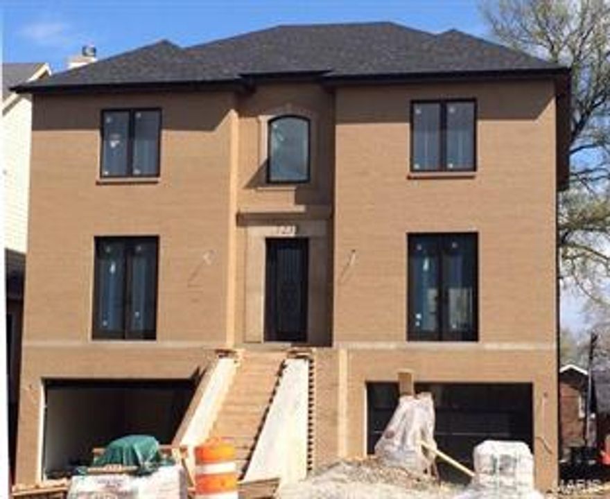 Introducing the 2nd of two custom Forsyth homes from GRID. Buyers who would like to make color and lighting selections are invited to discuss personalization options for a June completion. The stately home welcomes you with an impressive 2-story entry, accented in limestone. Distinctive details include 9 foot ceilings, crown molding, hardwood floors, surround sound and recessed lighting throughout. The center island kitchen features double ovens, 6 burner gas range, French door refrigerator, a wet bar/butler pantry with wine storage. The kitchen, dining and family room are open flowing spaces leading to a covered deck. The walk out lower level is finished with stone floors and a full bathroom. The interior photos are shown as an example of finish level from #7229 Forsyth Boulevard, which was completed and sold in the fall of 2014.