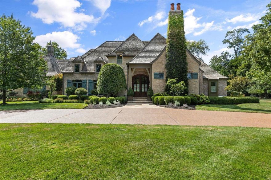 Simply splendid in every way! This magnificent recently built second empire estate home will stand the test of time! The finest details of yesterday & today down to the ivy covered chimney & the dramatic carved wood millwork. Every room is specially appointed
& the cabinetry throughout is divine. Entertain with ease as the floorplan is open, bright & inviting, where each space makes a statement that is both welcoming & distinctive. The kitchen-breakfast area blends easily with the adjoining great room & is luxuriously equipped with high end appliances, two large islands, stacked cabinets with a variety of door & hardware treatments & twin frig/freezer. Custom beams & vaulted ceilings, unique bar/wine room with glass lit wine storage & cabinets, & main floor primary suite that is something out of a dream. Three sets of French doors to tongue in groove covered outdoor room with fireplace overlooking romantic grass edge pool & private lot. Walk-out French doors from the lower level too! Additional Rooms: Mud Room, Wine Cellar