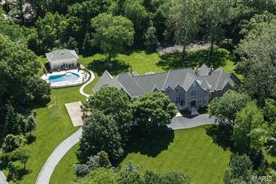 Outstanding 17 year old custom home on 2.84 landscaped acres in the heart of Ladue. The owner’s attention to detail is evident throughout, this 6+ bedroom, 11,700+ sq. ft. home.  A two story entrance hall with floating wrought iron staircase opens to a soaring living room and formal dining room. The library with cypress paneling and arched bookcases leads to the large master suite with luxury bath, his/her closets & sitting room. Loggia with 2 sets of French doors spans the back of the house leading to a bar area, butler’s pantry and top of the line kitchen /hearth room. Main floor laundry, mudroom, screened porch, additional bedroom & full bath.   Upstairs are 4 bedroom en suites, fabulous playroom, & another  en suite bedroom on 3rd floor. Lower level w/ media room, exercise room, wine cellar and ample storage.  Pool house w/ kitchen & full bath, heated pool, 4 car oversized garage, 3 fireplaces, large patio, tennis ct. and so much more! Additional Rooms: Mud Room
