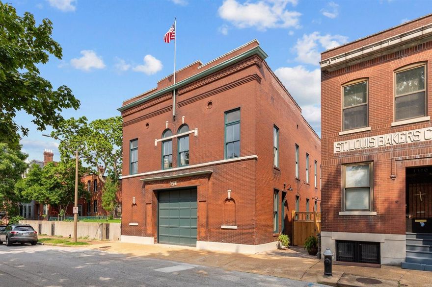 Firehouse No. 7 is a stunning, private residence offering over 7,000 square feet of meticulously designed living space. This exceptional home features two full kitchens and four luxurious suites, including a palatial primary and a main level bedroom retreat. The original firetruck bay, a versatile 1,600+ sq ft space with a motorized overhead door, can accommodate anything from cars to offices or events. The finished basement includes a wet bar, home theater, half bath, and ample storage. An elevator provides access to the first and second floor and is sky-bound to a rooftop deck with breathtaking views of the Arch and downtown. Additional features include an over-sized, two-car garage, off-street parking for up to four vehicles, and a private brick courtyard. The home is equipped with cutting-edge systems, including four new, zoned, high-efficiency HVAC units, all new plumbing and electric with dual 200-amp services, and a new roof all offering the best in modern living. Some Accessible Features