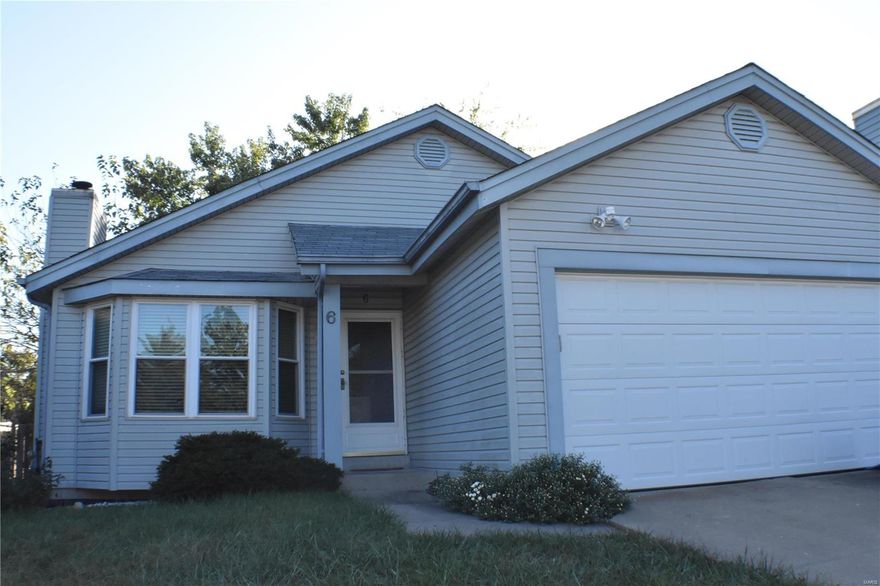 This home has a lot to offer, is priced to sell, but needs a little TLC.  This 3 bedroom, 1.5 bath home is ready for your finishing touches! Features include hardwood, vaulted ceiling and marble wood burning fireplace.  Master bedroom has his and hers closets with vaulted ceiling and plant shelf. This property is just the right size and offers a manageable fenced back yard.  Zumwalt South schools. Please schedule today!