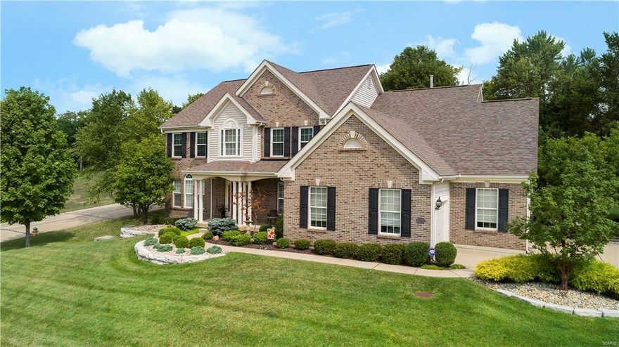 Tapawingo Golf Course Community. Beautifully updated 1.5 story with 4 bedrooms and 4.5 baths. Numerous updates including new luxury master bath in 2017, new roof 2016, beautiful new hardwood flooring on main level in 2016, new hot water heaters in 2016, new upper level A/C in 2015 and newer granite counter tops and stainless appliances in the kitchen. This home also features a finished basement with game room, office, full bath and dry bar. The gourmet kitchen is spacious and perfect for family gatherings. The main floor master features a new bath with dual sinks, vanity, separate tub and shower. The upper level features a bedroom with en suite full bath, an additional 2 bedrooms share a Jack and Jill bath and a loft area. The hearth room has a gas fireplace. The great room is very spacious and comfortable. You'll enjoy formal dinners in the separate dining room. The private lot is  1/2 acre. This beautiful home must be seen to be appreciated! 12 Month AHS warranty included.