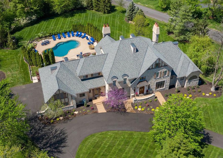 MAGNIFICENT EUROPEAN COUNTRY CHATEAU. Beautiful STONE & STUCCO exterior. RUSTIC YET ELEGANT CHARM indoors. 8' wide grand staircase. Handsome 7" wide plank floors. 10'-21' CEILINGS! Stunning architectural details of rough-sawn timber beams span across vltd ceilings. GOURMET KITCHEN w/stnls Viking aplncs, custom cabinetry, beautiful granite, 8'center island, & glassed-in wine closet. Venetian plaster walls/ceilings. Lovely full bar features handpainted Irish countryside mural. Grand Hearth Rm w/ flr-to-ceil stone fplc & French doors leading to WONDERFUL SALT WATER POOL W/ 2 LARGE PATIO AREAS -- PERFECT FOR ENTERTAINING! Spacious mn flr Mstr Ste has coffered ceil w/accent lighting. Mstr Bth features Aquatic Serenity air tub & steam shower. His/Hers w-i closets. Private Study. Upstairs are 3 bdrms (each w/full bath & walk-in closet) + Bonus/Rec Rm. LL features 2 more bdrms, each w/full bth, Rec Rm, Game Rm, Theatre Rm, Weight Rm, full bar & 1/2 bath! 3 new HVAC systems in 2020. STUNNING!