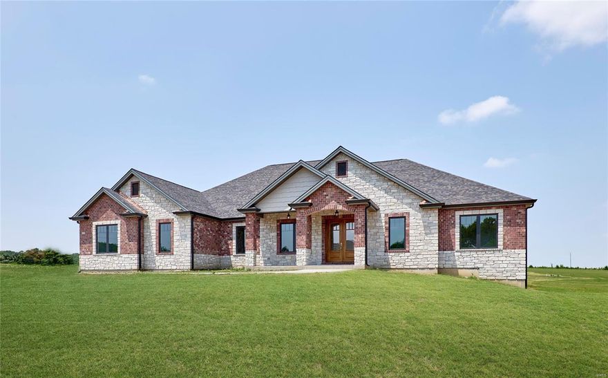 Brand new elegant custom ranch home on a 3 acre lot in Kohler Estates Subdivision just waiting for you to occupy. This home with over 5400 square feet of living space includes, 6 bedrooms 5 full baths, a gourmet kitchen complete with custom cabinetry and complete appliance package, a large great room with brick and stone gas fireplace. This home has 10 and 12 foot high ceilings on the main floor with custom mill work, a large covered rear porch with wood ceilings, 8 foot tall interior doors, Anderson windows and much more. A large finished walk out lower level complete with 9 foot ceilings, a custom wet bar, another bedroom and full bath, large rec room and separate work out room or media room. Dual zone heating and cooling and dual tankless water heaters included in this exquisitely constructed home. Convenient location just minutes from Lake St. Louis and Augusta Wine Country! Additional Rooms: Mud Room