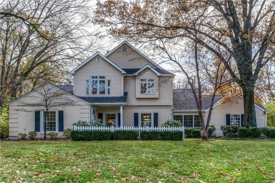 Beautifully situated under a green canopy of trees on a quiet lane, this immaculate storybook cottage style home artfully combines captivating style and timeless sophistication.  Rich hardwood floors, beautiful mill work, and light-filled spaces accent the home throughout the main level.  An inviting neutral palette subtly integrates the formal and informal areas. The charming kitchen with breakfast area is a perfect gathering place for friends and loved ones. Discriminating buyers will also appreciate the stainless appliances, custom cabinetry, granite counters, and French doors leading to the large deck and level yard beyond.  The upstairs boasts an exceptional master suite with a sunny sitting room, large walk-in closets and vaulted ceilings. The gracious luxury bath features two sinks, jet soaking tub and large walk-in glass shower.  Other important features include elegant formal living and dining rooms, family room with large bay, sprinkler system, and built-in cubicles.