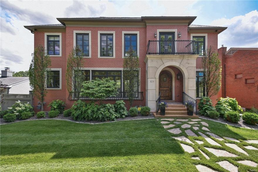 Stunning detailed custom Clayton home, 4 car garage, fenced private yard, outdoor living area, whole home audio, cameras & more! Travertine tile entry that continues thru the spacious LR/DR, connected is a perfect entertaining space; granite wet bar, icemaker, bev/wine fridges. Main floor suite offers full bath. Large kit w/ custom glazed cabinets & top of the line appliances, prep sink, eat in area & bar seating.  Hearth offers coffered ceiling, gas fp, built ins, hand scraped wood floors.  1st and 2nd floor laundry rooms.  Elevator is accessible to all 3 floors. Upstairs MB boasts double door entry, gas FP, vaulted ceilings & beautiful master en suite, including large soaker tub, glass surround shower, dual vanity & huge custom closet. 2 additional beds (1 being used as office) & full bath w/steam shower. The lower level offers built ins, wine cellar, full bath, wet bar & 4 car gar. Exterior features a travertine veranda, FP & BBQ area, spa, landscape lighting & sprinkler system.