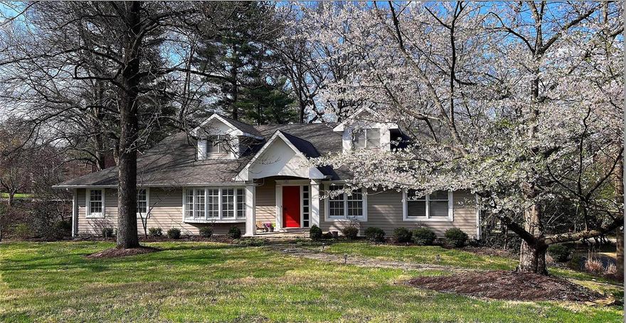 Don't miss this picturesque 1.5-story Ladue charmer on large corner lot! Design-savvy renovation from head to toe! Dreamy color palette, hardwoods, open floor plan & incredible natural light set the stage. Sun-filled living room (courtesy of bay window) is perfect for conversation. Phenomenal chef's kitchen boasts chic cabinetry, quartz counters, sleek white GE Café appliances, champagne bronze hardware, pot-filler & walk-in pantry. Stylish dining room (graced w/built-ins) offers easy entertaining. Casual elegance abounds in the great room w/pretty stone fireplace & access to maintenance-free deck.  Main floor primary suite sports barn door that opens to his/her closets & the most luxurious bath you can find, tub/separate shower, double vanity, Brizo fixtures, you name it! Two add'l bedrooms/two full baths also on the main floor. Plus, two spacious bedroom suites upstairs that flank a cheery loft area. Walkout LL w/family room, half bath & storage. 3-car. Short walk to Tilles! Love it! COOL: 14 SEER+