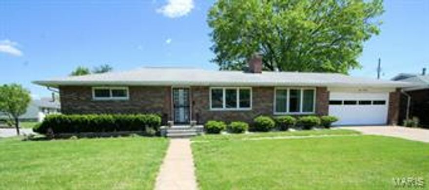 Enjoy this beautiful 3 bedroom, 1.5 bath brick ranch near Willmore Park. Open Living & dining room boast hardwood floors, a stone gas fireplace, updated lighting and coffered ceilings. Spacious master suite with beautifully updated half bath with marble surround, pedestal sink plus two double closets. Two additional bedrooms on the main level. One with hardwood floors, nice closet space and ceiling fan. Additional bedroom was a complete addition with brick wall accent, newer carpeting, ceiling fan and large picture window. New windows installed in '07 offer lovely natural light throughout the home. Breezeway connects to the two car garage. The kitchen has great views of the fenced in well manicured backyard. Many cabinets accommodate the kitchen and white appliances. Completely updated full bath- marble surround and flooring, custom vanity and updated fixtures. Poured concrete basement and glass block windows, updated electric, tons of storage & ready for your finishing touches! Additional Rooms: Mud Room