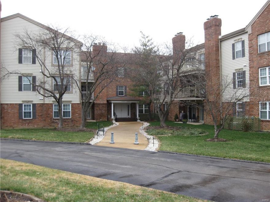 This gorgeous condo has been updated to MOVE IN CONDITION! It is located within a very secure building on 1st floor, NO STEPS, and Elevator service to the garage! This 2 bedroom, 2 bath, 1,192 sf Condo is FRESHLY PAINTED neutral and has NEW PLUSH CARPETING through-out! Large Master Bedroom, In-suite, w/WIC. Large 2nd bedroom provides a California Closet Organizer. Excellent Kitchen w/custom white cabinets, Breakfast Bar/pass thru, black appliances including refrigerator w/water line, ice maker and double SS sink w/disposal and plenty of hard surface counter tops. Raised brick hearth wood burning fireplace w/mantle and custom 4" crown molding are among the nice touches. For convenience an in unit washer/dryer! Large lobby w/game room upon entry and climate controlled garage parking. The building is located off Fee Fee on a private no traffic thru street.  Seller is providing a Home Warranty for Buyers peace of mind. Don't miss! A Great Buyer's Value at $88 sf! Location: City, Corner Location, Ground Level, Interior Unit