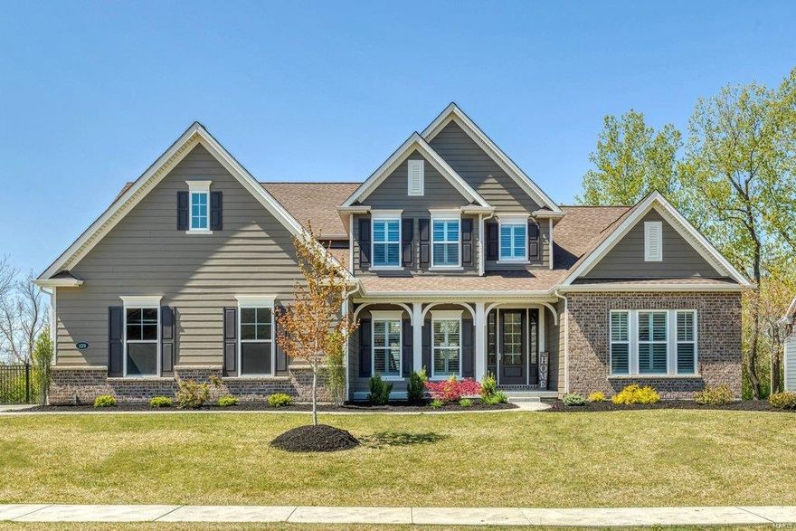 This spectacular Fischer & Frichtel-built 1.5 Sty features sophisticated interior detailing & appointments throughout including handscraped hardwood flooring, plantation shutters & designer lighting. Impressive hardwood foyer leads to private study, formal dining room & stunning great room with 11’ ceiling, granite bar & wall of windows that overlook wooded ground. Spacious open kitchen with 42” white cabinetry, granite countertops, KitchenAid appliances & 7’ center island adjoins breakfast room with butler's pantry & hearth room with marble fireplace & atrium door to deck. The master bedroom suite & luxury bath with freestanding tub offer an appealing retreat. The 2nd floor extends the living quarters with 3 additional bedrooms, 1 with ensuite bath, hall full bath & bonus room. Walk-out Lower Level includes recreation room with wet bar, game room, family room with linear gas fireplace, 5th bedroom & full bath. Situated on a 1-acre lot with fenced backyard, patio, deck & 3-car garage. Additional Rooms: Mud Room