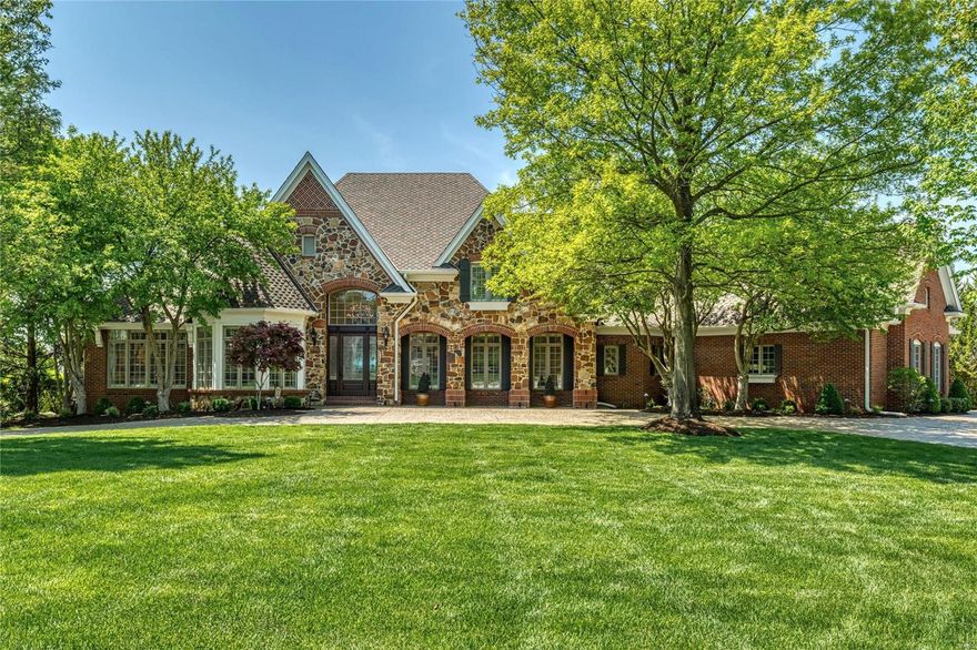 This beautifully designed 1.5-sty Homearama showhouse features soaring ceilings, detailed trim work, plantation shutters & pecan hardwoods that extend throughout the main floor. Barrel-vaulted marble foyer leads to private study with French doors, elegant dining room & stunning great room with fireplace & dramatic wall of windows that overlook parklike grounds. Designer kitchen with 42” glazed white cabinetry, granite countertops, premium appliances, 9’ center island & convenient planning center adjoins light-filled breakfast room & groin-vaulted hearth room highlighted by granite fireplace. Coffered primary bedroom suite with freestanding tub offers an appealing retreat. Front & rear staircases access 3 additional ensuite bedrooms & bonus room with work center. Lower Level includes recreation room, game room & kitchen with adjacent dining area plus office & full bath. Situated on a 1+-ac lot with paver patio with fireplace & grilling station & hot tub surrounded by landscaped gardens. Additional Rooms: Mud Room