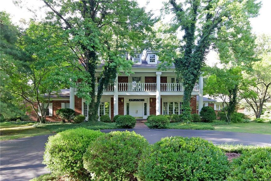 Welcome to this lovely plantation style home on a very secluded, wooded lot. The two story entry features a gracious staircase and opens to the spacious living room and dining rooms, both accented with large bay windows. The kitchen has double sinks, a center island and double ovens and has a large first floor laundry room nearby. Completing the first floor is a breakfast room, light filled family room with wet bar and first floor master that boasts a gas fireplace, two walk in closets and a luxurious master bath with a steam shower, Jacuzzi tub and double sinks. Upstairs you will find 4 generously sized bedrooms, two of which have french doors to the front upstairs balcony plus two full baths and and an office/6th bedroom with built in bookcases. The lower level has wonderful recreation space with a wet bar plus tons of storage. Enjoy the swimming pool and patio area in this private back yard. The four car garage is a fabulous bonus!