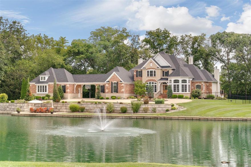 BACK ON THE MARKET AT NO FAULT OF SELLER EXTRAORDINARY Estate nestled on 10 secluded acres. Admire the 3 acre stocked lake as you drive through a gated entry & approach this magnificent 1.5 story home w/over 6700 sq ft of living area. It's a resort feel in the office overlooking the lake.  Multiple entertaining spaces include formal dining room, breathtaking 2 sty gr. room that admires heated pool through palladian windows & an intimate hearth room w/stone fireplace. Gourmet kitchen offers butler pantry, island & granite cntertops.  Amazing master ste has fireplace & french doors leading to a sunken hot tub on private deck. Mstr bath features walk-in shower, sep tub & custom walk-in closet. Enjoy a loft & 3 lrg bedrooms on the UL, each w/walk-in closets & baths. The finished walk-out LL has a theater room, custom bar w/granite, bdrm #5, full bath & gym.  Minutes from shopping & corporations--Mastercard (13 min); GM (6 min); Centene (16 min); Bayer (35 min); NISC (8 min). 2 Tax ID#s