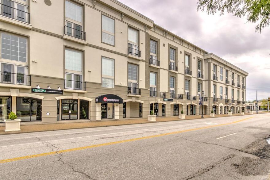 STUNNING 2+BR/2.5 bath Station Plaza Loft with soaring ceilings and walls of glass. At approximately 1800 square feet, this is the largest floorplan in the building and one of only two 2-bedroom units with a direct Plaza view. You can listen to the concerts, watch the parades & see the fireworks from your balcony. Sleek updated kitchen with quartz countertops & stainless steel appliances. Kitchen opens to the 2-story main living area with dry bar & wine fridge, multiple seating & dining areas and access to the balcony. A main floor laundry & updated powder room complete the first floor. Second floor features 2 large bedroom suites & a loft area which can be used for additional sleeping area or office. New flooring, paint & trim throughout. The only unit in the building with 3 garage spaces and climate-controlled interior storage space. Station Plaza amenities include gym, business center & rec room. WALK to shopping, dining, nightlife and ALL that DOWNTOWN KIRKWOOD has to offer. Location: Corner Location, Downtown, End Unit