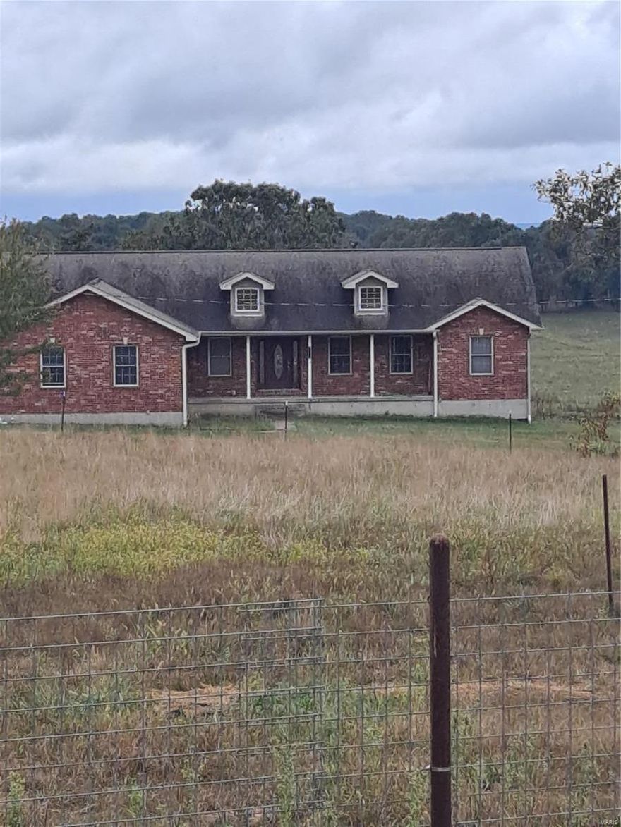 Welcome to La Quercia Viva. 211 acres of pristine pastures and grazing land.  The 4 bedroom 3 bath brick home has a full finished walkout basement, 2 car attached garage, and a nice covered back deck overlooking a stocked pond and beautiful views of the farm.  There is also a newly constructed 120 x 80 barn with 40 x 120 concrete center area for feeding with 2 heated automatic waterers.  Two 20 x 120 sections for hay  equipment storage or stalls, a 16 x 20 feed/tack room with 1/2 bath water, electric and mini-split.  There is also another 40 x 60 garage/workshop with a 40 x 60 lean-to.  This property is ready for your livestock and horses.  The land has been kept fertilized and limed with new fences on the perimeter and cross fences.  There are 9 paddocks, 7 automatic waterers 10 frost free faucets, a corral/head chute and 2 cyclops fence chargers that stay.  There is also a garden spot, an orchard with grapes, raspberries, peach, pear and apple trees,  and 2 wells. Lots of wildlife.