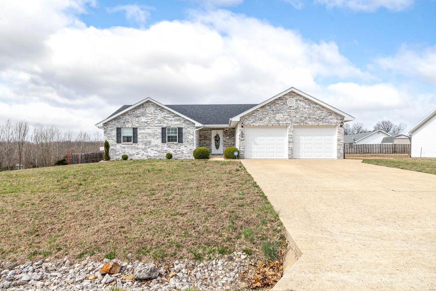 Built in 2007, this 3 bedroom two bathroom located in Northern Heights Subdivision sits on, .36 ac m/l. This beautiful home comes with many high end fixtures and custom lighting. Laminate, ceramic tile, and carpet flooring throughout. Newer HVAC system and open concept floorplan. Covered porch and large deck overlooks fully fenced, level, yard on corner lot. Comes with firepit setup in the back yard as well. Kitchen has custom cabinets, stainless steel appliances, and light streaming inside from large windows. Master has large walk-in closet, double vanity, and shower/tub combo. Schedule a showing today!