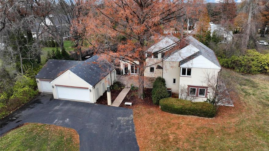 Unique estate setting on 1.5 private acres with circle drive and inground pool in Frontenac.Three bedrooms, two full baths, two half baths, 2,845 sqft and oversized 3-car oversized garage.Courtyard invites guests into living room with floor to ceiling windows, hardwoods floors flowing throughout into updated kitchen w/maple cabinets w/crown, gas range, farmhouse sink, travertine backsplash, quartz counters & butler pantry with wet bar.Dining room opens to office and family room with gas fireplace all overlooking front acreage.Spindled staircase leads to owners suite w/dual closets, updated hall bath, walk-in closet, two additional bedrooms and sunroom.Beautiful landscaping surrounds rectangular swimming pool w/pebble tach along w/side patio & wood burning stone fireplace just off kitchen that is perfect for entertaining.Copper gutters, slate roof, highly rated Ladue School District on 1.5 level acres goes unmatched for this location in Frontenac priced under one million!