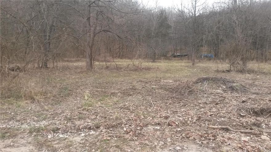 Level .94 of an acre corner lot for building or home site. Property is agent owned.