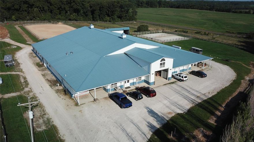 Income producing boarding/training stable for sale in Foristell on 30+/- acres. Off paved road w/lots of road frontage to 2 county highways just inside Warren Co. Amazing horse property w/gated entry, completely fenced. Over 20,0000 sf insulated  and heated building houses 23-30 stalls separated by 115x72 indoor arena w/ GTE dust free footing, bay doors, kickboards, sprink system. Wide heated Aisleways. 4 wash stalls hot/cold, laundry, 2 tack rooms & 2 feed rooms. 2 trainers can work easily out of one barn. 900 sf apartment has 2 bedrooms, 2 full baths, laundry, kitchen, family room. Lounge is 900’ sf including an office and gathering area with ½ bath and kitchen. Outdoor arena is 100x200 with lighting, great footing & drainage. 6 dry lots, 5 run-in shelters, 15 grass pastures w/wood, electric fencing & heated auto-waterers. Outbuilding stores 1500 bales of hay, 30x25 Lean-to for tractor, mower, equip. Plenty of extra space for storage. 10 acres w/pond has perfect walk-out home site!