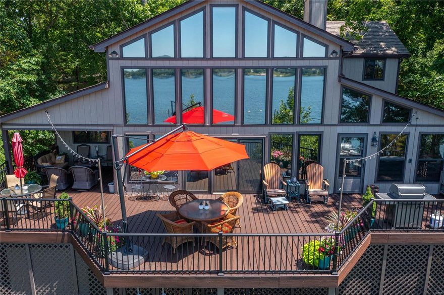 Innsbrook's FINEST chalet to hit the market, look no further than this luxury vacation home on LAKE ASPEN, one minute from the main gate and to ultimate relaxation. This is the vacation home for generations, where memories are created. Built for year-round living, this is one of the very best waterfront lots on Innsbrook's premier recreational fireworks lake. Just steps to the water's edge, enjoy million-dollar views & lakeside living like never before. This chalet with its lodge-like interior has everything you need and more, including zoned HVAC, 2700 sq feet of living space, large bedrooms, open living & dining rooms, master suite w/outdoor shower; hearth room w/2 sided fireplace & French doors for extra sleeping space. The new maintenance-free deck is partly covered and includes steps down to the beautifully landscaped yard with an inground sprinkler system. Golf cart and some furnishings included; other furniture, pontoon boat negotiable with offer.