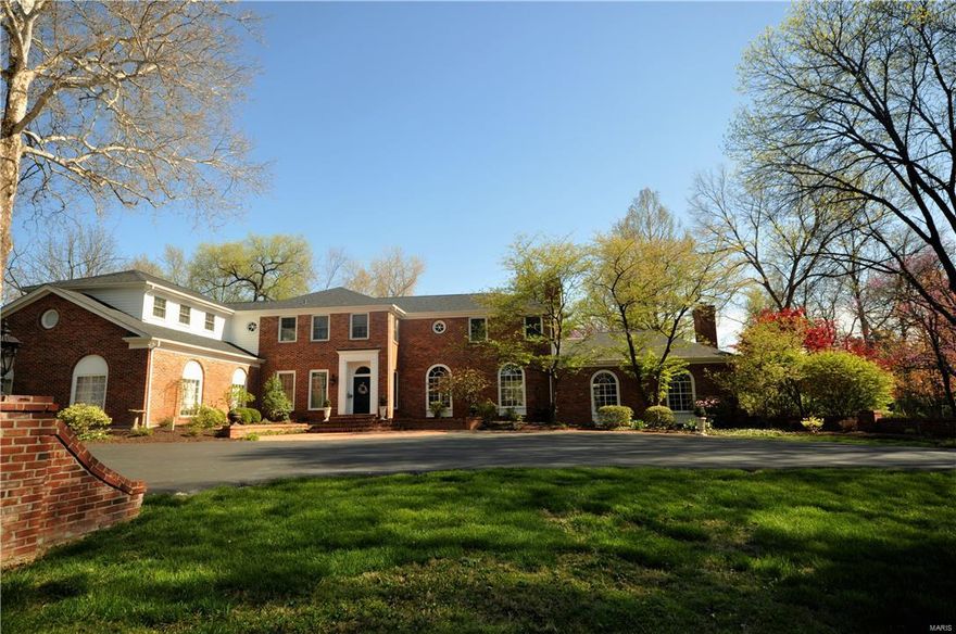 1.8 acre estate in the heart of Ladue is an entertainer's dream! Gated drive leads to the entrance of home. 5 bed/6.5 bath home offers 6000+ sqft of luxurious living space.  Grand Foyer opens to window-lined gallery leading to Great Room with elevated ceilings, built-ins & fireplace. Office features fireplace & view to pool.  Wood-paneled library has built-ins & french doors leading to courtyard. Eat-in kitchen perfect for the home cook w/built-in desk, great storage & granite counters. Family Room has wood burning fp, renovated bar w/ice mkr, dishwasher, wine captain & mini fridge. Indoor Hot Tub room adjacent to Family Room & Bar.  Completing this wing are 2 full baths convenient to the hot tub & pool. Upstairs you will find a bright yet cozy Master Bedroom with fireplace, built-ins, walk-in closet & master bath. 4 add'l bdrms complete the 2nd flr, 2 with en suite baths and 2 with Jack & Jill bath. Courtyard features pebble sheen pool, gazebo, fountain and professional landscaping. Additional Rooms: Mud Room