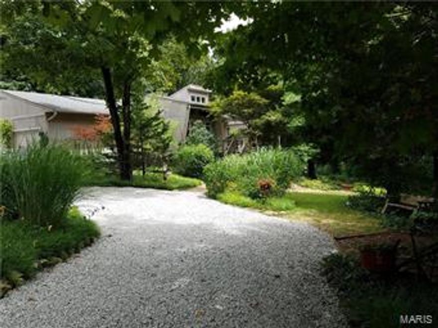 THIS HOUSE IS A MUST SEE !!!! The yard around the house is like a Botanical Garden and if you want privacy there is plenty of it here. The house inside is beautifully decorated with lots of country charm and neutral colors. Very large family room and very large eat-in kitchen with a newer Jenn-air stove and beautiful counter tops and solid surface style big double sink. Walk through the sliding glass doors onto a beautiful back deck overlooking part of the garden area and some of the timber and enjoy a beverage listening
to the sounds of nature. There is a large walk-in closet in the master and old country charm for the master bath with a beautiful soaking tub. the house has a central vacuum system and laundry could easily be converted back to the main floor. With a full walk-out basement with a half bath already in place the possibilities are endless. Call today to schedule your private showing !!!!!