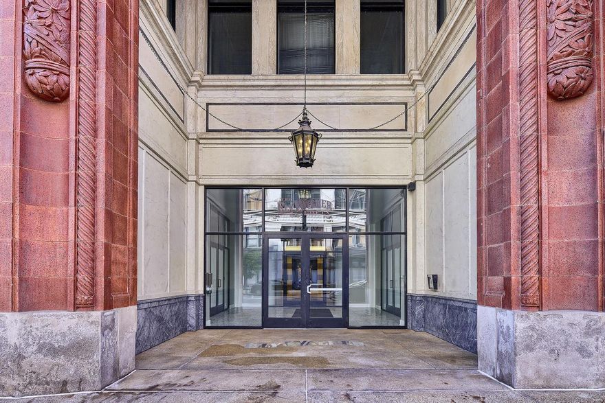 Here is a gorgeous Ely Walker condo unlike any other.  Updates have been made with high end finishes. Kitchen now has custom cabinetry, quartz counter tops, newer appliances.  Bathrooms have custom designed glass and porcelain tiled sower with state of the art glass sliding door, add in comfort height toilets and vanities. One of the larger floor plans in the building.  High walkability with everything from coffee shops, to events, to shopping and restaurants within minutes.  You won't be lacking on any amenities here: community room, rooftop deck, exercise room and Luxer One package locker system. $150/mth in building parking space available. Location: City, Downtown