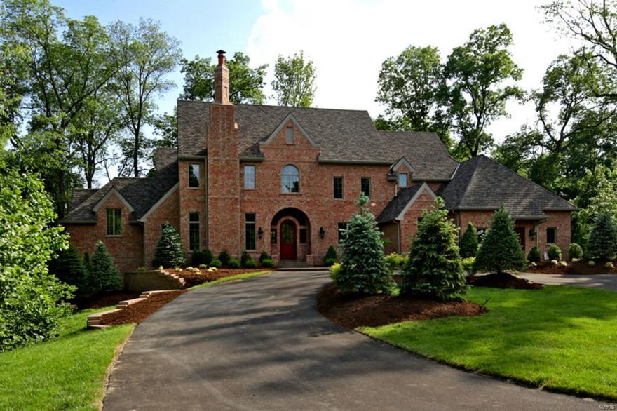 Modeled around the DeShetler Homes tradition of building the finest, most luxurious homes in the St. Louis area, our newest offering is a stunning testament to the quality craftsmanship & attention to detail!  This 1.5 sty all brick home is ready for immediate closing. The 1st flr boasts 4305 sq ft, a 2 sty entry foyer w/barrel vault ceiling & fine moldings throughout. The Den has fully paneled walls & ceiling, bookcases, cross hatch beams, full masonry fplc w/custom mantle & marble surround. The 2 sty kitchen & breakfast rm features barn beams & band boards w/hand carved corbels, Top of the Line appls & custom cabs.  The "Dirty" Kitchen off the rear of the kitchen has a spacious desk area, appliance space & blt-in food storage. The 2nd flr features 1625 sq ft & 3 generous BR's, each w/its own bath & a lge 20x13 activities area. The fin LL offers a spacious bar, gorgeous fplc, add'l BR w/its own bath & a W/O & plenty of storage! This home sits on 1.8 AC lot w/4 car gar & sprinkler sys.