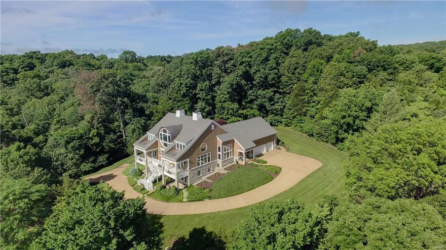 This 1 1/2 story custom home situated on 10 acres, in a beautiful one of a kind equestrian community. Offering SO MANY NEW 2015/2016 UPDATES!! New Roof including  custom copper barrel; lots of new windows and cedar shake siding; hardwood flooring throughout has been refinished in a warm brown tone; all new carpeting on second level and carpeting main level areas; back porch with waterfall view has all new screens; new energy saving main GEO thermal HVAC unit; not to mention, all new guttering and downspouts plus new doors on the 3 car oversized garage!! Bright kitchen has 42" cabinets stainless steel appliances and  opens into the breakfast area as well as the family room each offering beautiful panoramic views of the horse pastures and Babler Park beyond . Master bedroom suite has vaulted ceilings. The master bath provides two vanities, separate shower and jetted soaking tub.  Lower level rec room, 5th bed. and full bath. Additional bonus room above the garage. Community fishing lake!