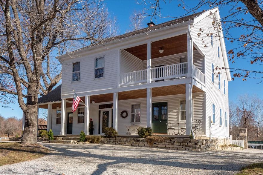 Historic 2.5 story, 5 bed, 2.5 bath home with 3,460 sq. feet of living space, situated on 5.64 acres located in Wildwood, Rockwood school district. Estate includes 6 stall barn, 2 pastures, stocked pond with fountain & 2nd home with 2 beds, 1 bath & 1,000 sq. feet of living space. Main home entry foyer leads to living room with hardwood flooring, recessed lighting, ceiling fan & wood burning fireplace with stone surround. Kitchen boasts 42" cabinets, tile back splash, granite counter top, center island with breakfast bar & stainless steel appliances. Breakfast room has hardwood flooring & atrium door that leads to paver patio with wood burning, stone fireplace & outdoor shower. Dining room has hardwood flooring & built in corner shelve with light. 2nd story includes master bedroom with ceiling fan & light, double closets & en suite bath. Bedroom 2 opens to a covered porch. Bedrooms 3 & 4 have hardwood flooring. Bedroom 5 has hardwood flooring, ceiling fan, loft & sitting room/office.
