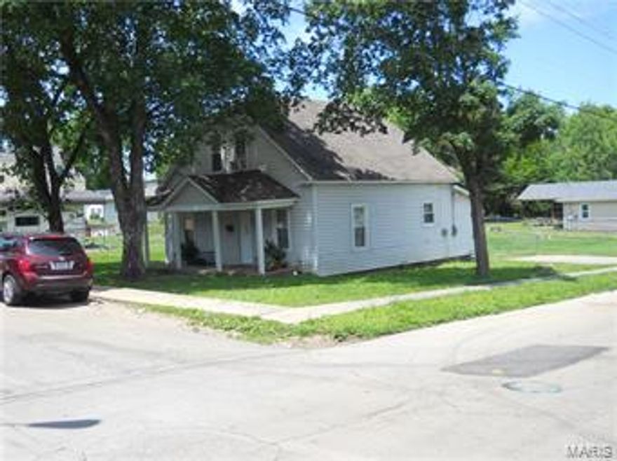 Good family home or good rental. Currently rented for $600 per month.  3 bedroom has large living room/dining room combo with laminate flooring. Eat in kitchen has laundry right off. covered front and back porches. Corner lot is fenced with chain link and there is a storage building.  Owner has other rentals that can be bundled with this for a great investment opportunity!!