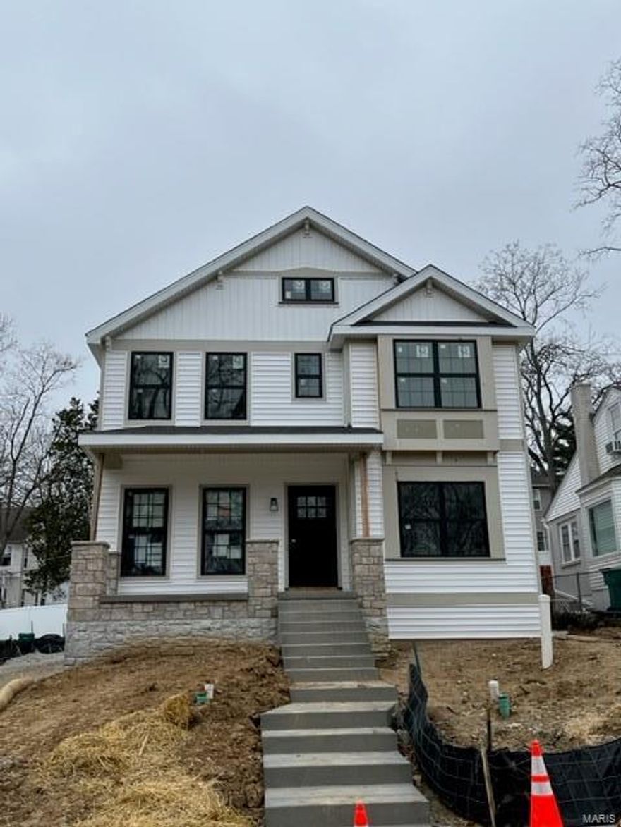 New custom modern farmhouse home under construction in Webster Groves.  This 5 bedroom, 3.5 bath home features 9' first floor ceilings, built-in bookcases on each side of fireplace in family room with shiplap above, hardwood flooring all of 1st floor and 2nd floor hall, full overlay custom kitchen cabinets with soft close solid wood drawers, crown molding, stainless steel appliances, Quartz countertops with undermount sink, coffered ceiling in master bedroom, luxurious master bath with double sinks, stand alone tub and shower, 2nd floor laundry room, and walk-in closets in all bedrooms, Quartz countertops in all baths, custom millwork with 3-panel doors, 3 1/4 inch casing and 5 1/4 inch base molding.  Finished lower level with rec room, full bath, and bedroom.  Fully sodded yard, 1 year builder warranty and 10 year structural warranty.