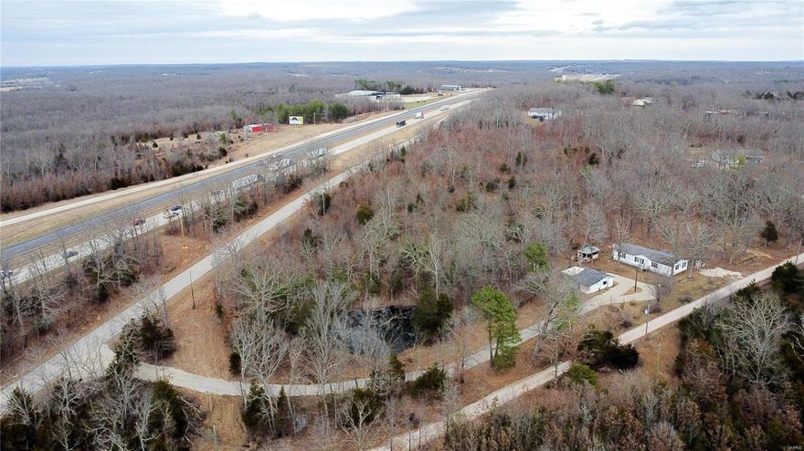 Are you looking for your next investment opportunity? Look no further than this 4-bedroom, 2-bathroom, 1,600+ square foot home on over 3 acres! No restrictions. This property has tons of room for expansion if you're looking to start your own cash flowing trailer park, or if you're looking for your next fixer upper to generate extra income. Brand new driveway strategically positioned to easily create new trailer pads. Located just minutes from town right off of Historic Route 66. This property has so many unique features including small pond right at the bend of the driveway, concrete block garage and storage area, partial fencing and much more. The current manufactured home sits on a permanent foundation with an attached covered deck. With a little TLC, this rare property could generate a ton of extra income or could be your new forever home!