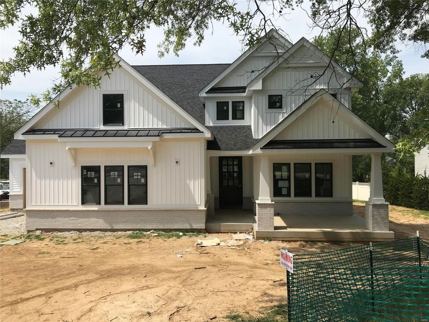 Spectacular modern farmhouse 1.5 story under construction by Boulevard Custom Homes.  This 4 bedroom, 3.5 bath, home features astounding finishes which include a 3-car side entry garage, metal roofs, job stained hardwood flooring 1st floor and 2nd floor hall, gourmet kitchen with true custom cabinetry, large island and peninsula counter, crown molding, soft close drawers, 3 lazy susan's, pull-out spice rack, trash pullout, Quartz countertops, stainless steel appliances, under cabinet lighting, large walk-in pantry, built-in lockers, and impressive screened in rear porch.  12' high beamed ceiling in great room offers a fireplace, wine bar with wine cooler,  den/study with beautiful wainscot. Elegant master bath suite boasts coffer ceiling, large walk-in closet, adult height vanities, stand alone tub in master bath.  Other amenities include mahogany wood front door, wood treads on stairs, a expansive 2nd floor bonus room, 2 full baths on 2nd floor, large bedrooms with walk-in closets. Additional Rooms: Sun Room