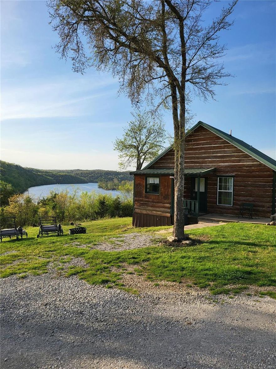 Perched high above Lake Taneycomo, one of the top world class trout fishing destinations in the country, sits Peninsula Cabin & RV Park on 18 acres m/l of the Ozark Mountains.  Located minutes from the Branson Landing, premier golfing, tourism attractions and multiple Johnny Morris Bass Pro developments, sits 3 renovated 1-2 bedroom rustic cabins with kitchens and covered porches with incredible panoramic lake views, a duplex, 3 additional cabins ready to renovate, 13 RV sites with 50/30/20 FHU with room for expansion, laundry and office complex. Bring your boat for the Rainbow Trout, Brown Trout, Largemouth Bass, Cutthroat Trout to the private dock with 2 boat slips, kayaking, hiking and more!  Solar panels provide approximately 50-60% of the power supply, private well.  Possibilities are limitless on this secluded, peaceful lake front 3 sided peninsula property.  Retire here while your investment works for you.  P&L's available, partial owner finance available to qualified buyers.