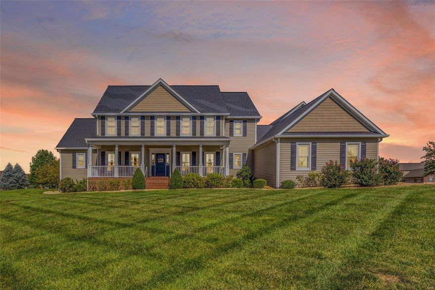 Welcome to this stunning 1.5 story home with the perfect floor plan for entertaining. Step in from the covered front porch to an amazing view of the 1 acre lot through the wall of windows in the Great Room! Gorgeous Acacia flooring graces the Great Room & Kitchen. The Kitchen is truly the heart of the home, nestled between the Great, Breakfast and Rec Rooms, and offers custom cabinetry, granite counters, SS appliances and a spacious pantry. The expansive Rec Room features a vaulted ceiling, a dry bar and adjoins the spacious, comfy theater room. Impressive, custom Laundry Room! The Master is tucked away from the main living spaces offering privacy and a spacious en suite with a whirlpool tub & walk-in shower. Additional MF spaces include two home office spaces and a formal Dining Room. The upper level features three large bedrooms and two full baths. The level lot provides the perfect blank slate for a future pool! Plenty of parking with a four-car garage and circle driveway, too!