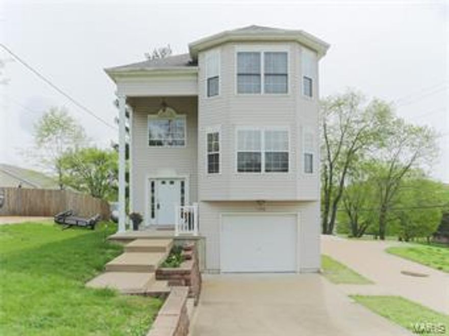 This darling, raised two story is one of a kind.  The large, open, floor plan is perfect for entertaining.  The first floor includes a generous sized family room complete with bay window.  The neutral kitchen with stainless appliances is open to the dining area, which walks out to a gigantic cedar deck, perfect for an outdoor gathering.  Half way up the stairs, you are greeted by a large picture window, the perfect cozy setting for a reading nook.   The large master bedroom features a bay window and ensuite.  Two additional bedrooms and a second full bath complete the upstairs.  The large level lot features a patio, which would be the perfect spot for a fire pit. Finally, the two separate single car, tuck under garages, give you options for whatever best suits your needs.  The extra long concrete driveway, gives additional spots for off street parking.  All of this is conveniently located, just 3 minutes from highway 55  Don't miss out on seeing this adorable home before its too late!