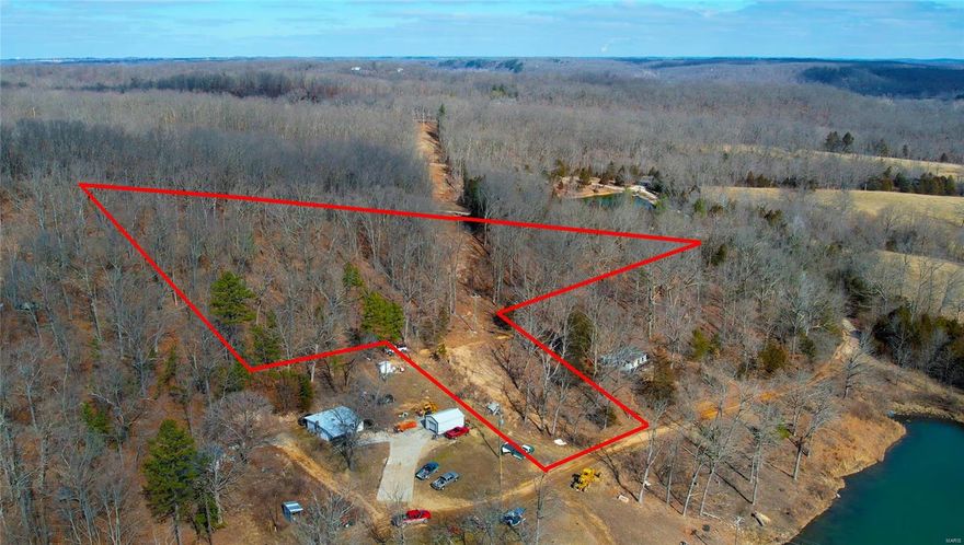 Looking for some land to put a cabin on? This 4.6 acres is only 5.6 miles south of St. Clair on Highway K. There is already a driveway and a small concrete slab that would be a perfect place for a cabin with a view of a lake.  Between Little Indian Conservation Area and Meramec State Park, this property is a very short drive to thousands of acres of public land and river access. Make this property your camp after a day of hiking or floating. No known restrictions. Please park in the driveway at the top of the hill on Lakesite dr. There are yellow stakes marking the edge of the driveway. More property available in a separate listing.