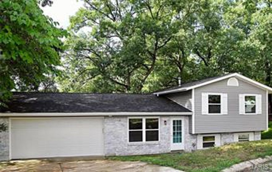 Move in Ready, updated, and on a fabulous private lot!  Newer roof, Newer windows, Newer siding, and newer sliding glass doors! This multi level is unique with its open floor plan and character. Main level offers new flooring, updated kitchen with access to your over sized 2 car garage with extra storage space.  The upper level offers 3  spacious bedrooms and large updated bath. Lower level will win you over with its trendy pallet wall and wet bar with built in shelving!  The Cozy fireplace tops off this wonderful space.  Walk out to the lovely back yard and patio.  Quiet and serene. Chickens will be removed as well as the coupe and run.